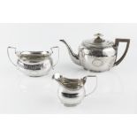 A GEORGE III SILVER TEAPOT, of oval form, engraved with Greek key and anthemion frieze, having