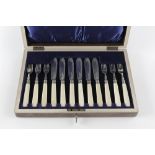 A SET OF SIX SILVER FISH KNIVES AND FORKS, with ivory handles, by R.F. Mosley & Co., Sheffield 1911,