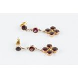 A PAIR OF GARNET EAR PENDANTS, each suspending a cluster of circular mixed-cut garnets in millegrain