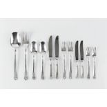 A SERVICE OF PERUVIAN SILVER FLATWARE, the handles with anthemion terminals, comprising serving fork