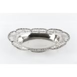 A SILVER OVAL BASKET, pierce decorated with swags of stylised foliage within scroll cast border,