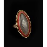 A GEORGIAN DIAMOND, ENAMEL AND HAIRWORK MEMORIAL PANEL RING, the navette-shaped panel centred with