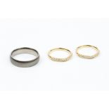 A PAIR OF DIAMOND SET HALF HOOP RINGS, each with a wishbone-shaped channel of round brilliant-cut