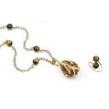 A COLLECTION OF TIGER'S EYE JEWELLERY, comprising a tiger's eye bead pendant, by Sannit & Stein, the