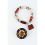 A HARDSTONE PANEL BRACELET, designed as a series of banded agate and chalcedony batons with