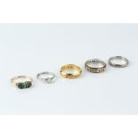 A COLLECTION OF RINGS, comprising a diamond single stone ring, stamped 'Plat', a diamond set band