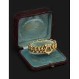 A LATE VICTORIAN HALF PEARL AND DIAMOND SET PANEL BRACELET, the articulated expanding bracelet of