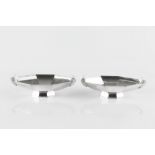 A PAIR OF ART DECO SILVER SWEETMEAT DISHES, each of elongated octagonal form, with ivory mounted