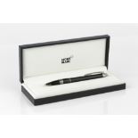 A MONT BLANC 'STARWALKER' BALLPOINT PEN, black, with service guide and original box