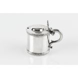 A WILLIAM IV SILVER DRUM MUSTARD, with gadrooned borders, scroll handle and heart pierced thumb