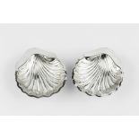 A PAIR OF SILVER SCALLOP SHAPED BUTTER DISHES, with glass liners, by Williams Ltd, Birmingham
