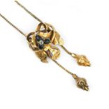 A VICTORIAN GEM SET PENDANT NECKLACE, the knot-shaped panel with foliate decoration, centred with