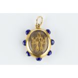 A VICTORIAN HAIRWORK AND ENAMEL MEMORIAL PENDANT, the dual-sided oval glazed compartment