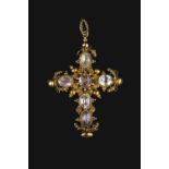 A 19TH CENTURY TOPAZ AND GEM SET CROSS PENDANT, circa 1820-30, the oval mixed-cut stones of pale