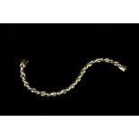 AN 18CT TWO COLOUR GOLD FANCY-LINK BRACELET, length 18.5cm