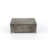 A SILVER RECTANGULAR CIGARETTE BOX, with engine turned decoration, on bun feet, by Henry Matthews,