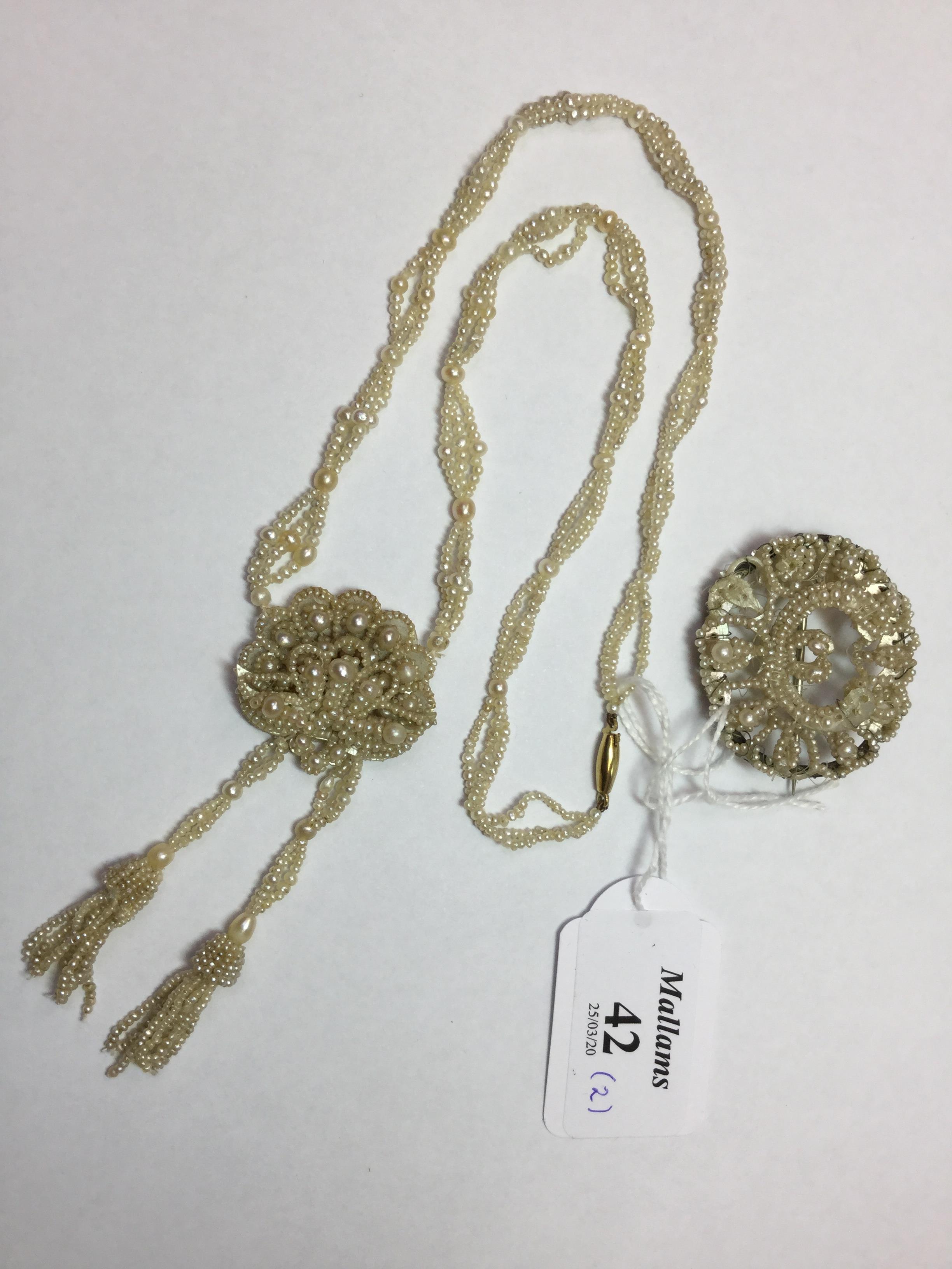 A SEED PEARL PENDANT NECKLACE, the chrysanthemum-shaped panel of graduated seed pearls issuing two - Image 2 of 3