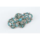 A 19TH CENTURY TURQUOISE AND HALF PEARL PANEL BROOCH, the undulating openwork panel of scrolls and