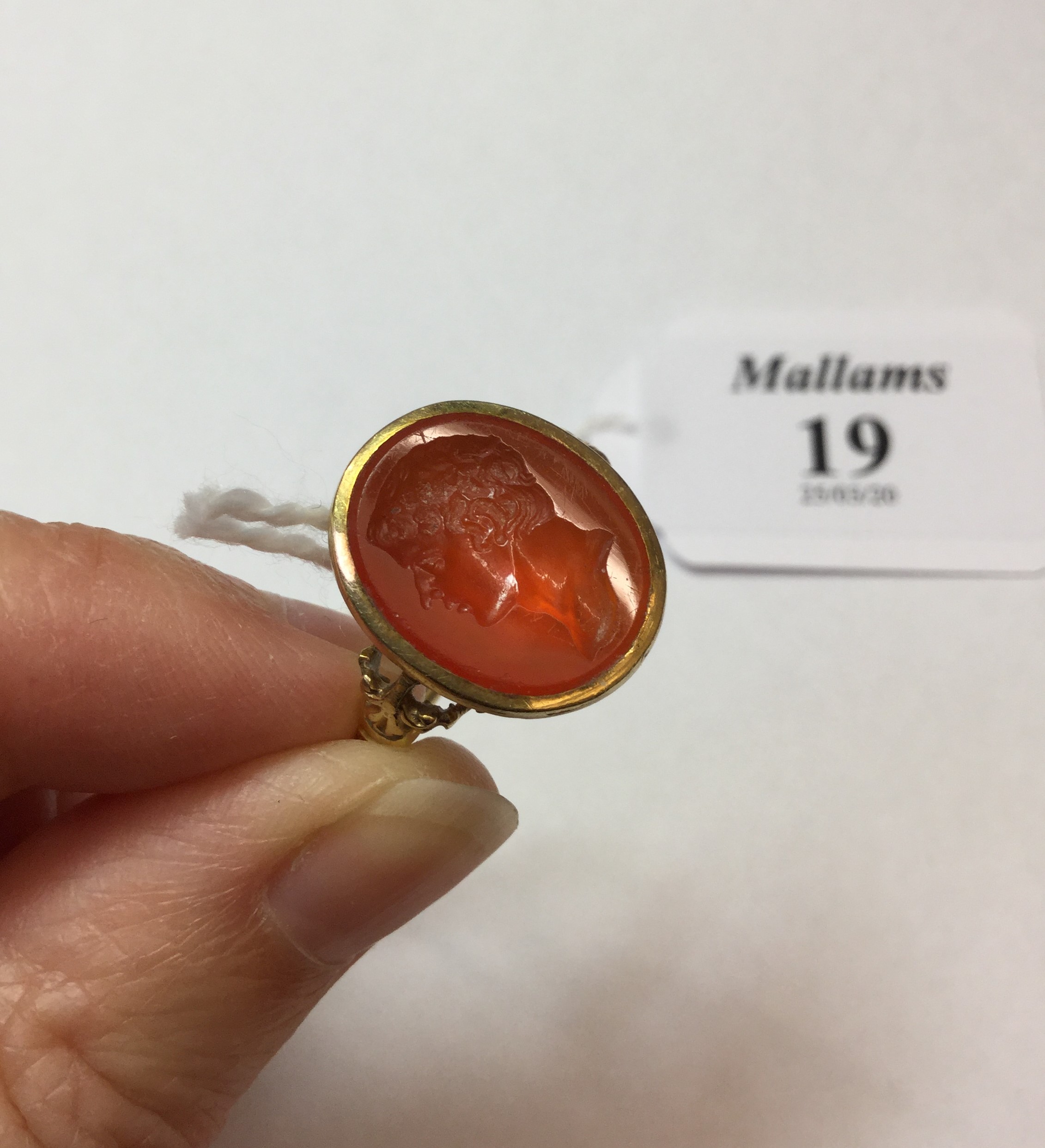 A 19TH CENTURY HARDSTONE INTAGLIO RING, the oval cornelian panel incised with a classical male - Image 4 of 7