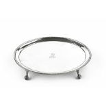 A GEORGE III SILVER OVAL TEAPOT STAND, with beaded border, on claw and ball feet, by Hester Bateman,