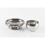 A SILVER SHALLOW BOWL, the spot hammered body with applied pierced stylised motifs, and having