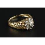 A DIAMOND CLUSTER RING, the tiered cluster of graduated round brilliant-cut diamonds in claw