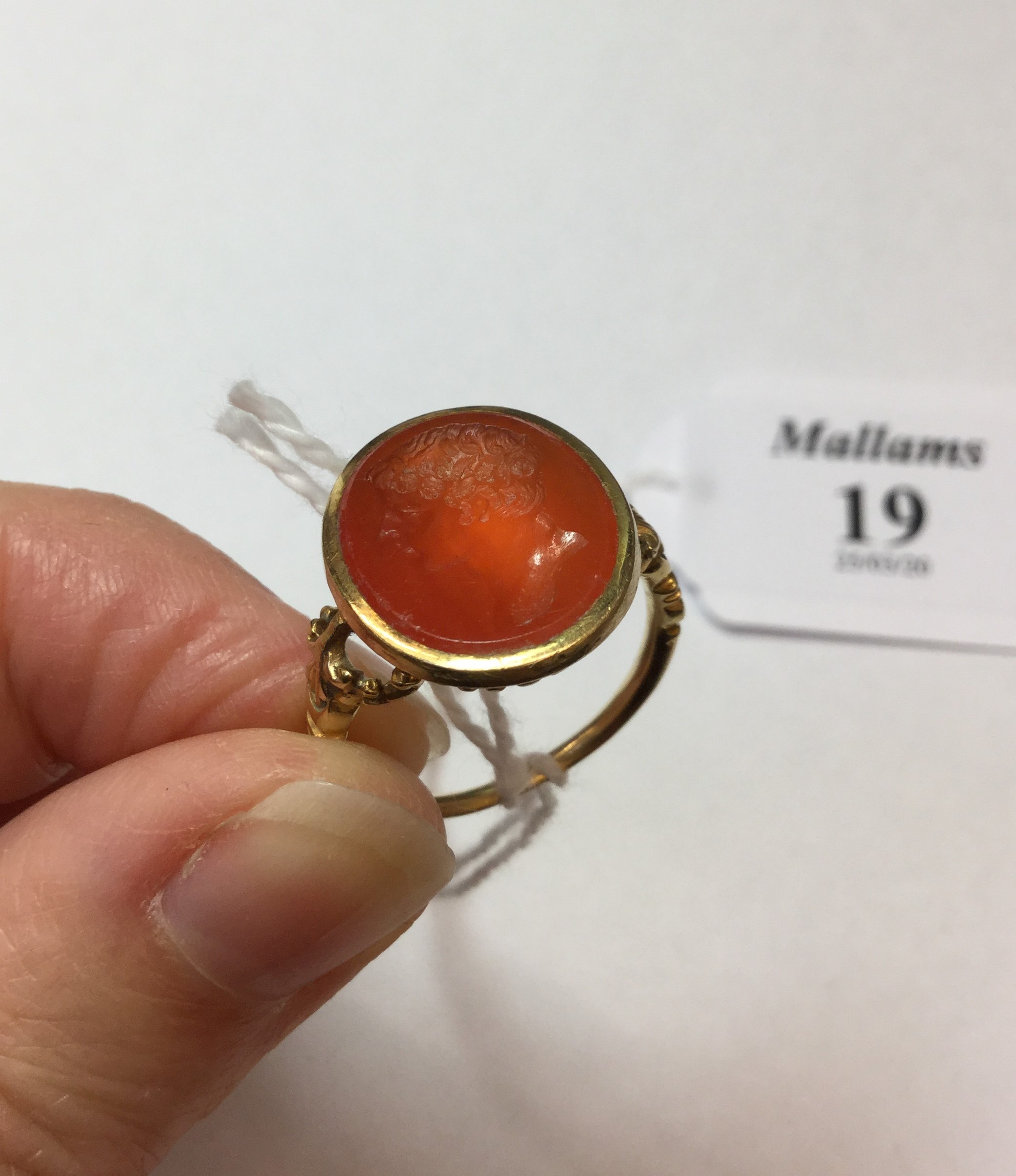 A 19TH CENTURY HARDSTONE INTAGLIO RING, the oval cornelian panel incised with a classical male - Image 3 of 7