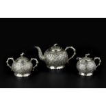 A LATE 19TH CENTURY CHINESE EXPORT SILVER THREE PIECE TEA SERVICE, each piece with globular body,