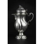 A LATE 18TH CENTURY GERMAN SILVER BALUSTER CREAM JUG, with wrythen body and hinged domed cover, on