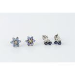 TWO PAIRS OF SAPPHIRE AND DIAMOND EAR STUDS, the first modelled as trios of circular mixed-cut
