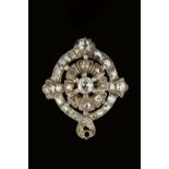 A DIAMOND PANEL BROOCH, the openwork tiered oval panel of graduated cushion-shaped old-cut