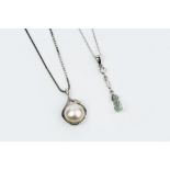 TWO DIAMOND SET PENDANT NECKLACES, the first suspending a briolette-cut blue stone drop, below a