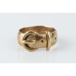 A SMALL COLLECTION OF JEWELLERY, comprising a 9ct gold buckle ring, a 9ct gold St Christopher