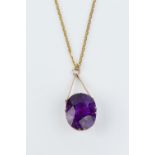 AN AMETHYST SINGLE STONE PENDANT NECKLACE, the cushion-shaped mixed-cut amethyst in claw setting,