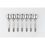 A SET OF SEVEN DANISH SILVER TEASPOONS by Georg Jensen, of Acorn pattern, 11cm, and one other