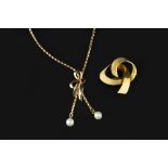 A CULTURED PEARL PENDANT NECKLACE, the fancy-link chain suspending two cultured pearl drops below