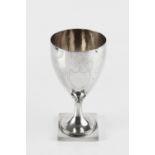 A GEORGE III SILVER GOBLET, with gilt interior, and bright cut vacant armorial, on circular beaded