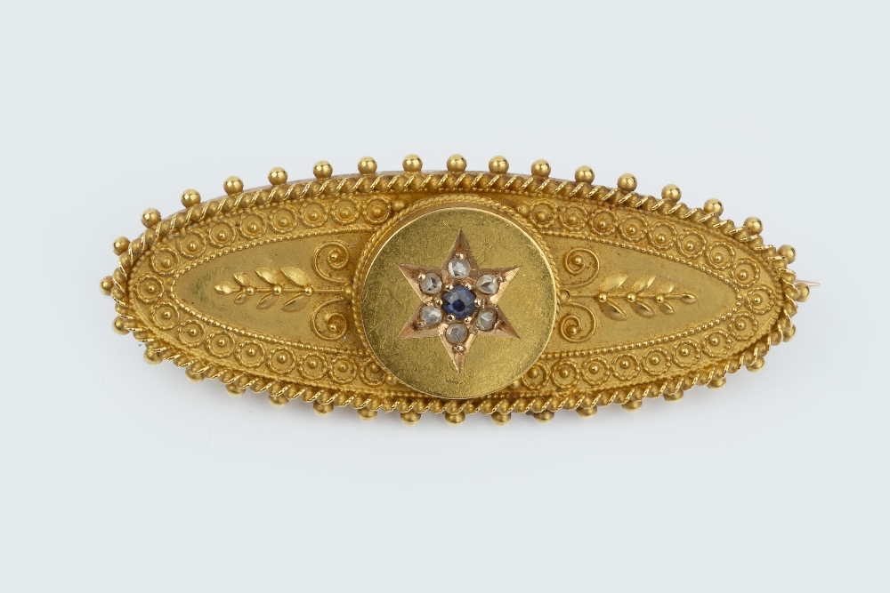 A LATE VICTORIAN SAPPHIRE AND DIAMOND SET PANEL BROOCH, the navette-shaped panel centred with a