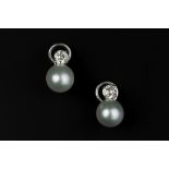 A PAIR OF CULTURED PEARL AND DIAMOND EARRINGS, each cultured pearl measuring approximately 9.5mm