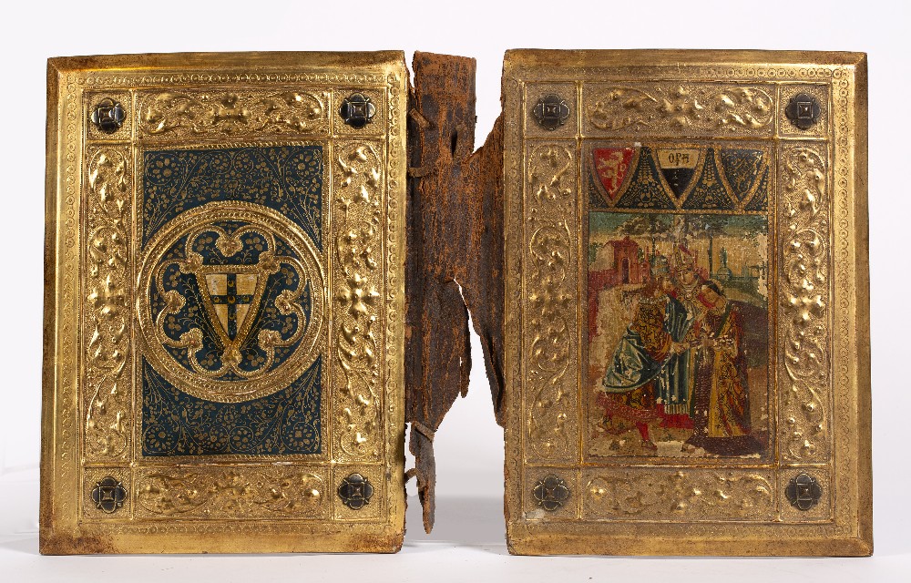 A 19th Century Siennese gilt gesso and wood book cover The upper panel printed with bishop and