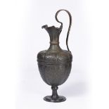 AN ITALIAN COPPER EWER, probably Venice 16th/17th Century, the sheet copper beaten and engraved with