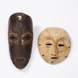 TWO DEMOCRATIC REPUBLIC OF CONGO LEGA MASKS, both carved wood, one with mother of pearl shell