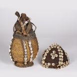 A KENYAN BORANA CALABASH CONTAINER, woven cane work and leather decorated with cowrie shells 32.