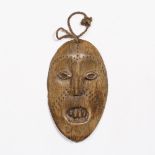 A DEMOCRATIC REPUBLIC OF CONGO LEGA LUKUNGU BONE MASK, with pin work decoration 14cm long