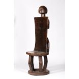 A TABWA THRONE CHAIR, Democratic Republic of the Congo, carved wood, round stool with open-work