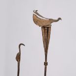 A YORUBA OPA ORERE RITUAL STAFF, Nigeria, cast metal mounted by a stylised bird together with one