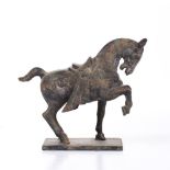 A TANG STYLE OXIDIZED FIGURE of a horse on rectangular base, 18cm high