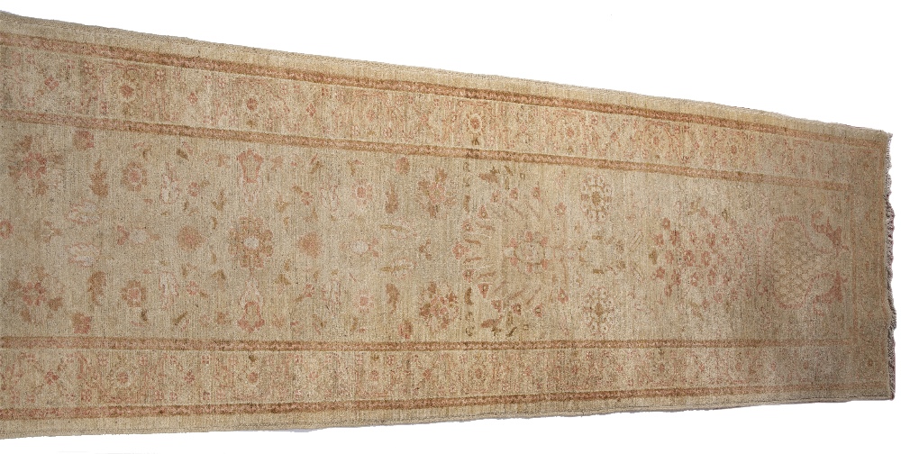 A ZIEGLER PALE GREEN GROUND RUNNER with a pastel flower ornament within a wide border, 391cm x 88cm - Image 3 of 4