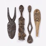 A MIXED LOT OF TRIBAL ITEMS, including two masks, a doll and a carved wooden spoon (4) provenance: