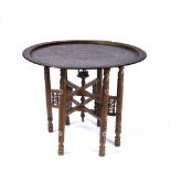 A LATE 19TH/EARLY 20th CENTURY ISLAMIC OCCASIONAL TABLE, heavy bronze top with the centre